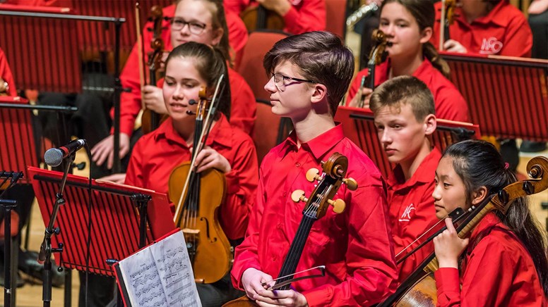 undefinedMain Orchestra NCOGB. Leader of the cellos Harry Scott-Burt acknowledging the applause following his solos in Scheherezade